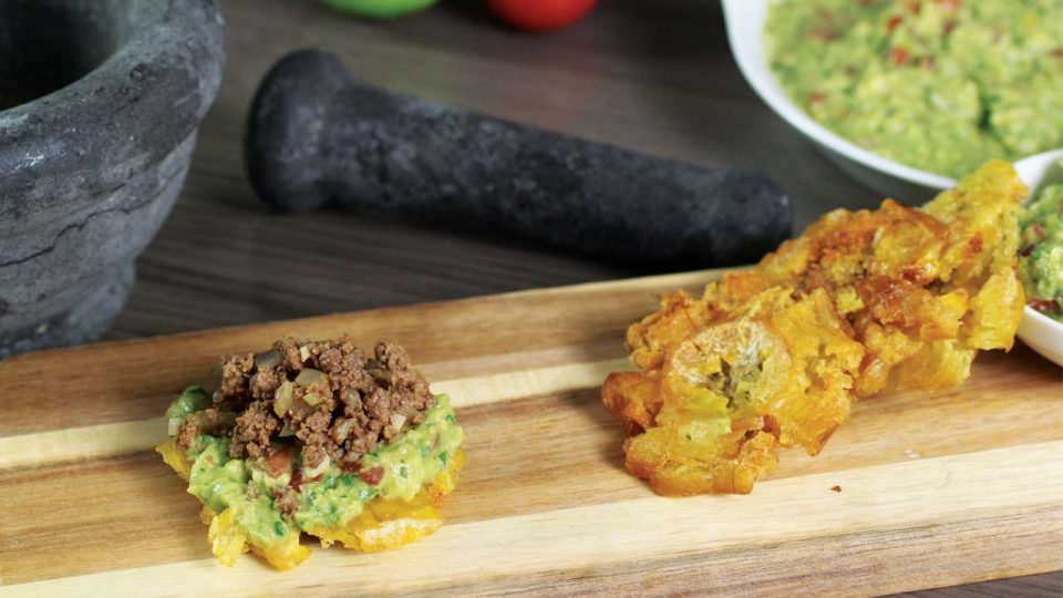 Bananenchips van bakbanaan Tostones, patacón pisao, bananes presées,platano frito, tachinos of chatinos,patacones